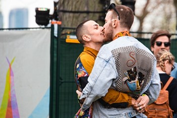 Two men kissing